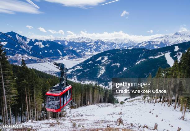 the red cabin of the lift in zell am see. winter landscape in the alps. austria - austria ski stock pictures, royalty-free photos & images