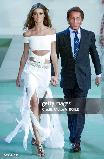 Fashion designer Valentino Garavani with Gisele Bundchen walk the runway during Valentino Ready to Wear Spring/Summer 2003 fashion show as part of...