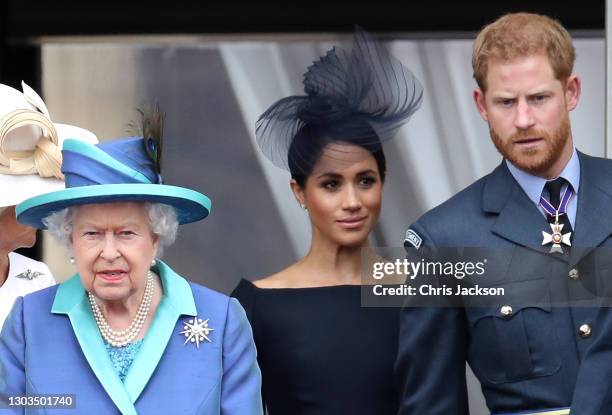 Queen Elizabeth II, Prince Harry, Duke of Sussex and Meghan, Duchess of Sussex on the balcony of Buckingham Palace as the Royal family attend events...