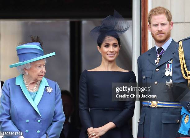 Queen Elizabeth II, Prince Harry, Duke of Sussex and Meghan, Duchess of Sussex on the balcony of Buckingham Palace as the Royal family attend events...