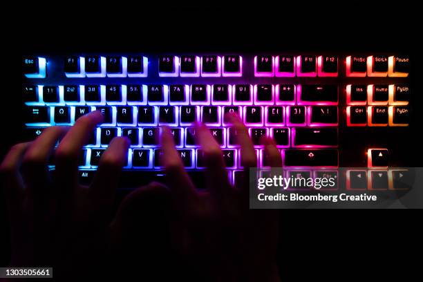 laptop keyboard and cyber crime - data breach fotografías e imágenes de stock