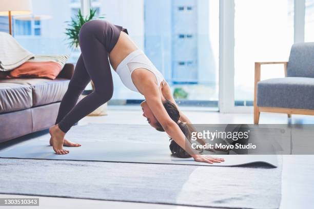 stretching out my stiff legs from sitting too long - downward facing dog position stock pictures, royalty-free photos & images