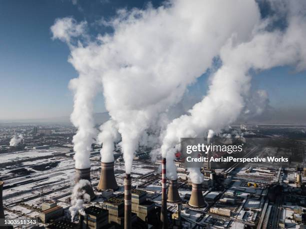 aerial view of coal fired power station in winter - air pollution stock pictures, royalty-free photos & images