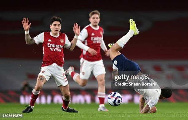 Gabriel Jesus of Manchester City is challenged by Hector Bellerin of Arsenal during the Premier League match between Arsenal and Manchester City at...