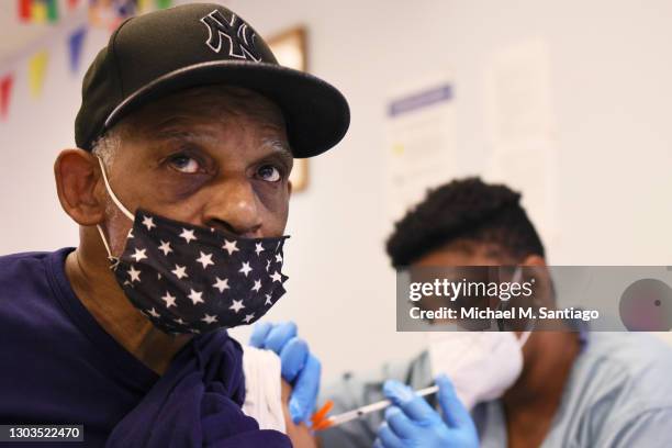 Dove John is given the Moderna coronavirus vaccine by Anya Harris at Red Hook Neighborhood Senior Center in the Red Hood neighborhood of the Brooklyn...