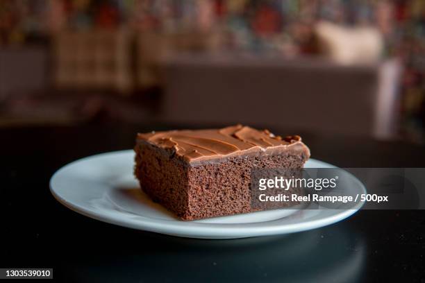 close-up of cake in plate on table - sachertorte stock-fotos und bilder