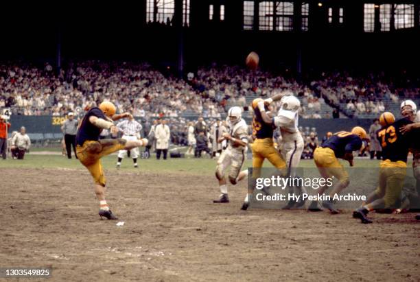 Kicker Jim Brown of the Illinois Fighting Illini punts the ball during an NCAA game against the Penn State Nittany Lions on October 24, 1959 at...