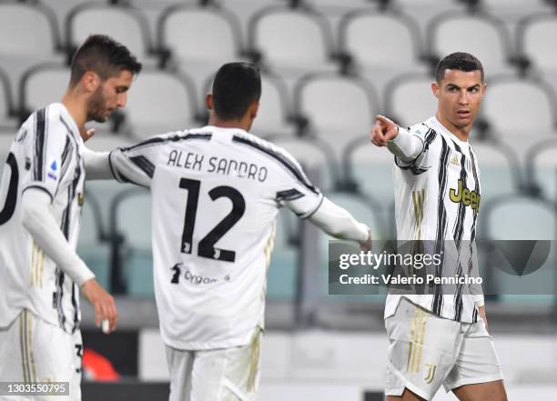 Cristiano Ronaldo of Juventus celebrates after scoring their team's first goal with Alex Sandro of Juventus during the Serie A match between Juventus...