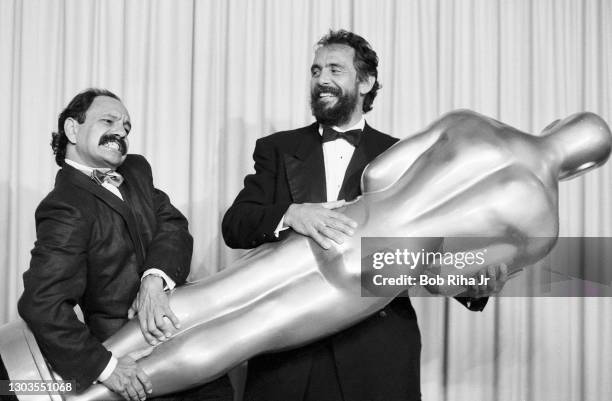 Oscar presenters Cheech Marin and Tommy Chong have some fun after presenting the Best Visual Effects Award backstage at the 56th Annual Academy...