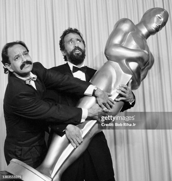 Oscar presenters Cheech Marin and Tommy Chong have some fun after presenting the Best Visual Effects Award backstage at the 56th Annual Academy...