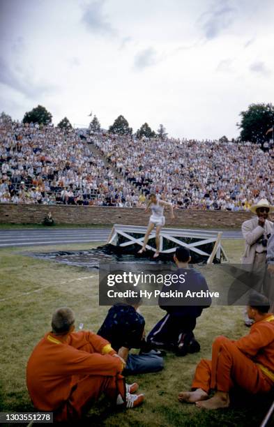 College athletes participate in the steeplechase event during the 1955 AAU Championships on June 25, 1955 in Boulder, Colorado.