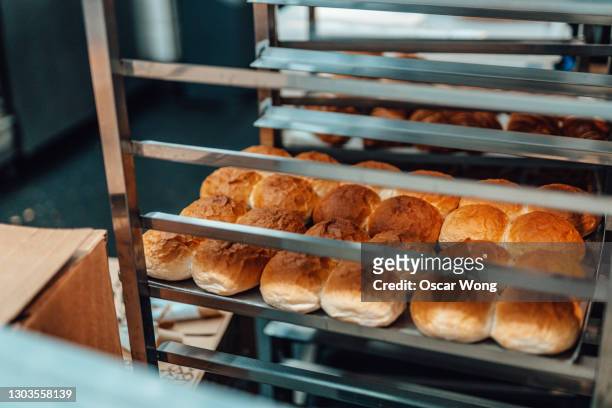 trays of bread in a bakery - supermarket bread stockfoto's en -beelden