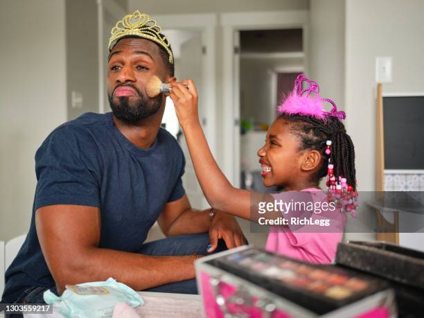 dad and daughter playtime dress-up and putting on makeup - princess stock pictures, royalty-free photos & images