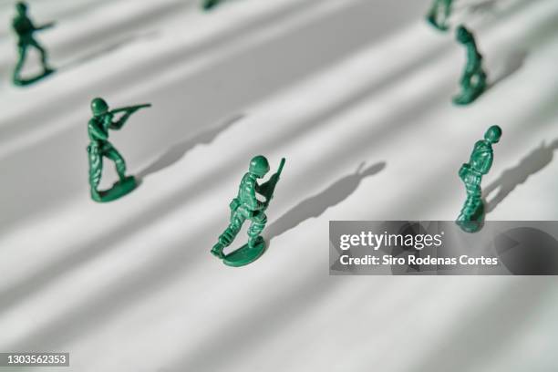 generic plastic toy soldiers - toy soldier stock pictures, royalty-free photos & images