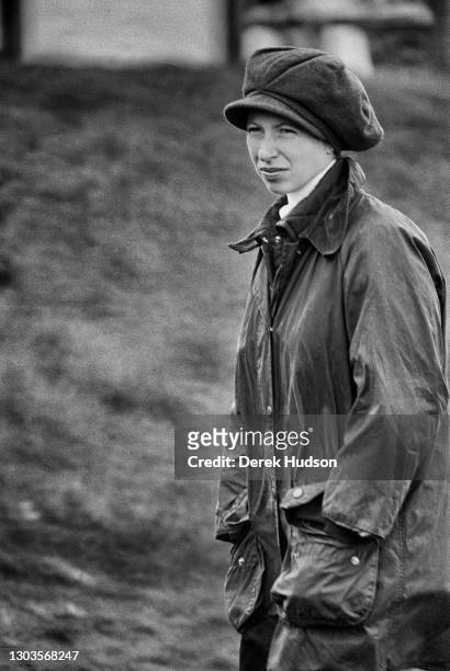 Circa 1975: Princess Anne, Princess Royal sporting a stylish buffoon style tweed cap with a Barbour waterproof jacket at the five day event Badminton...