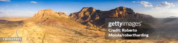 aerial panoramic by drone of the desert valley at feet of gheralta mountains, hawzen, tigray region, ethiopia, africa - etiopia foto e immagini stock