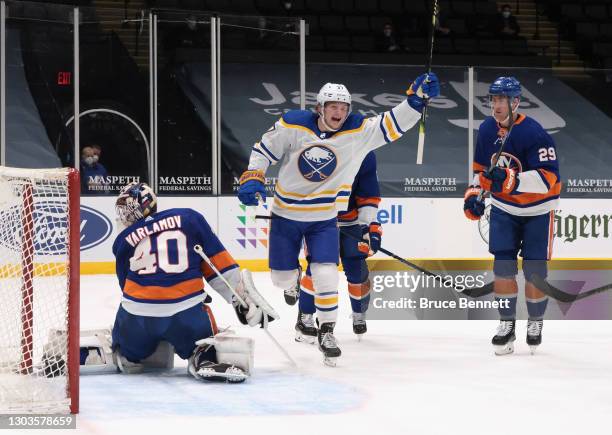 Casey Mittelstadt of the Buffalo Sabres celebrates a goal by Curtis Lazar at 17:15 of the first period against Semyon Varlamov of the New York...