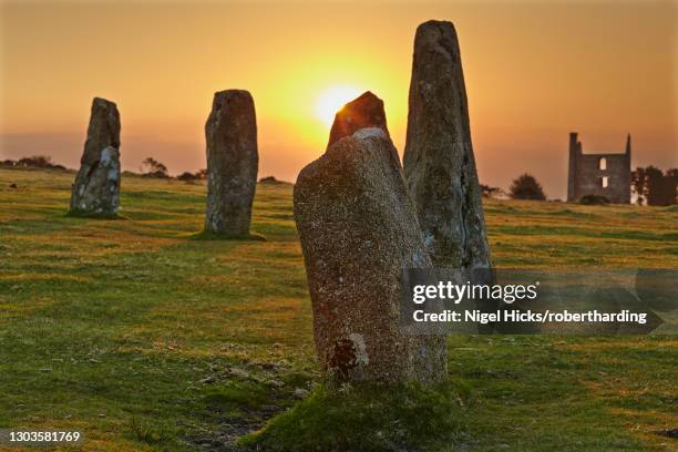 sunrise over standing stones at the hurlers, a series of prehistoric stone circles on bodmin moor, near liskeard, east cornwall, england, united kingdom, europe - bodmin moor stock pictures, royalty-free photos & images