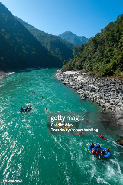 rafts and kayaks drift down the karnali river in west nepal, asia - white water kayaking stock pictures, royalty-free photos & images