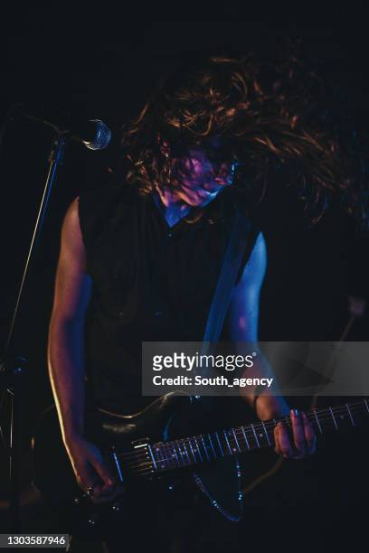 guitarist performing on stage - pop musician stock pictures, royalty-free photos & images