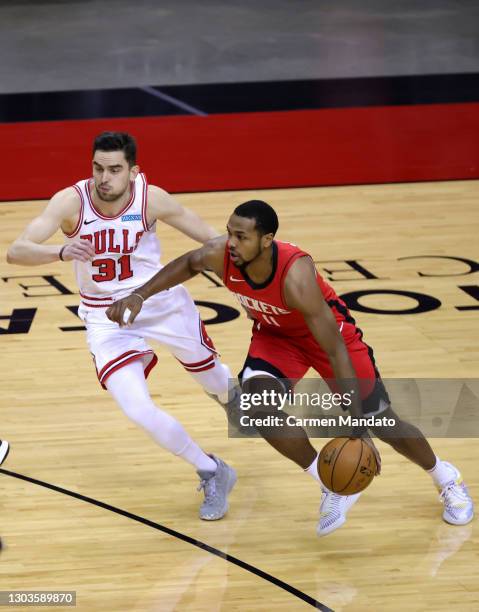 Sterling Brown of the Houston Rockets drives against Tomas Satoransky of the Chicago Bulls during the first quarter of a game at the Toyota Center on...