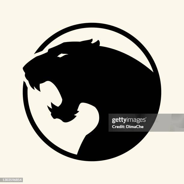 black leopard, panther head - vector cut out silhouette in circle - jaguar teeth stock illustrations