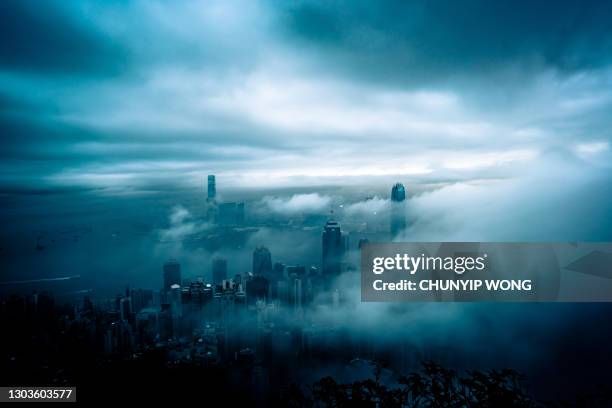 low visibility on victoria harbour in hong kong - climate change money stock pictures, royalty-free photos & images