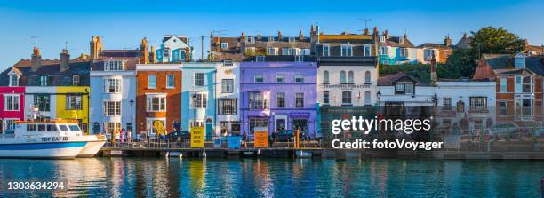 harbour houses colourful fishing cottages seaside quay panorama weymouth dorset - weymouth dorset stock pictures, royalty-free photos & images