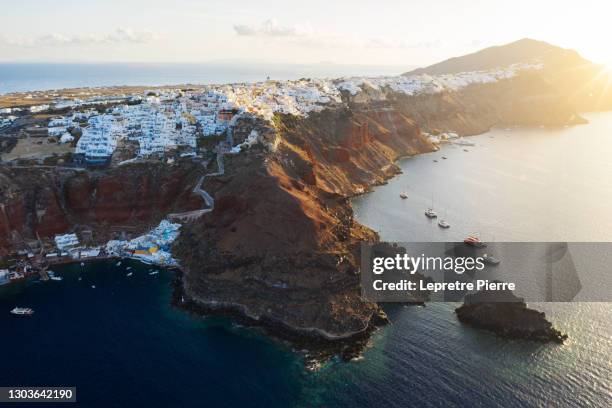 oia (and amoudi bay) at sunrise from de sky, santorini, greece - amoudi bay bildbanksfoton och bilder