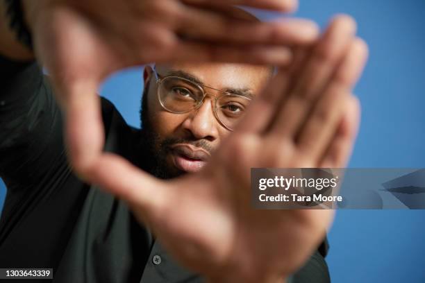 young making looking through hands - clarity concept stock pictures, royalty-free photos & images