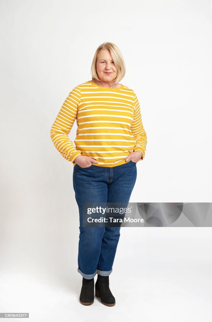 Mature woman standing in studio