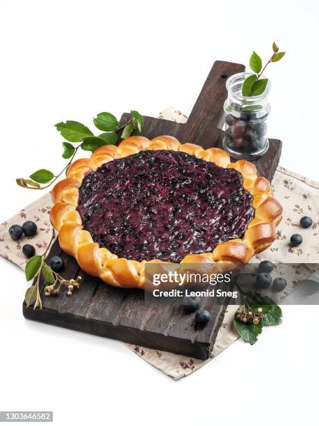 food photography of blueberry tart (pie) on a white background isolated side view - blueberry pie isolated stock pictures, royalty-free photos & images