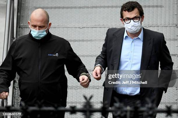 Simon Bowes-Lyon, the the Earl of Strathmore, leaves Dundee Sheriff Court in handcuffs after being sentenced to jail for 10 months for sexually...