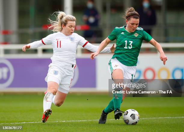 Abbie Magee of Northern Ireland is challenged by Lauren Hemp of England during the Women's International Friendly match between England and Northern...