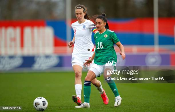 Jill Scott of England battles for possession with Louise McDaniel of Northern Ireland during the Women's International Friendly match between England...