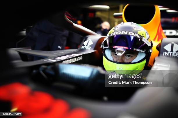 Sergio Perez of Mexico and Red Bull Racing prepares to drive in the garage during the Red Bull Racing filming day at Silverstone on February 22, 2021...