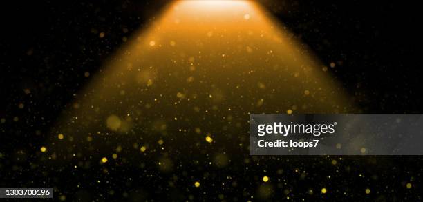 dust & orange light against black background - disco lights stock illustrations