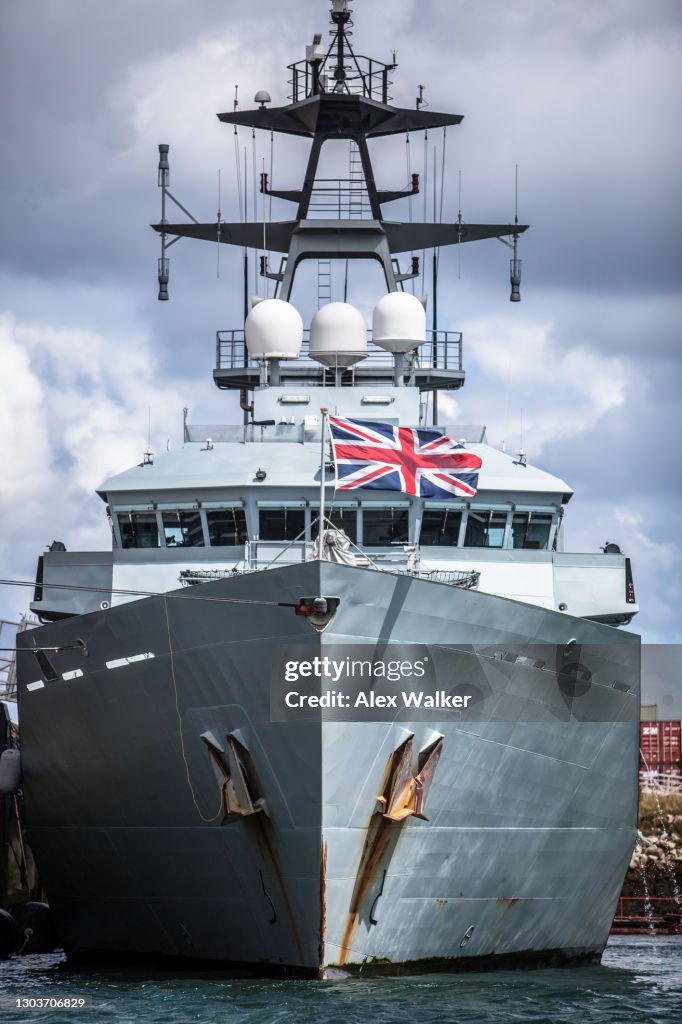 Grey Navy boat with British flag