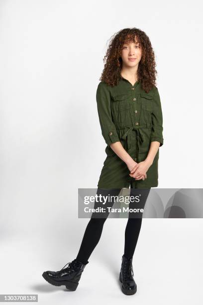 young woman standing - causal dress stock pictures, royalty-free photos & images