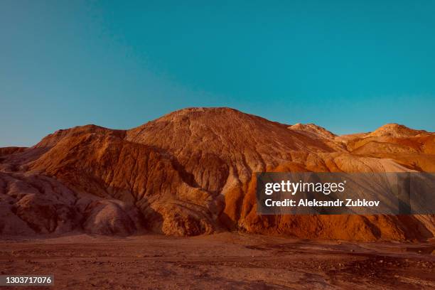 ural apocalyptic surreal unusual landscape, similar to the surface of the planet mars. the frozen red-brown surface of the earth. barren, cracked and scorched earth and soil. the concept of global warming. clay quarries. there is water or a river on mars. - mars stock pictures, royalty-free photos & images