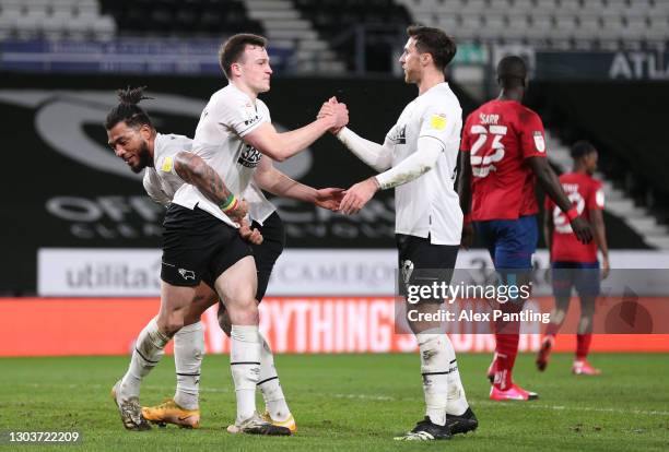 George Edmundson of Derby County celebrates with team mate Colin Kazim-Richards and Lee Gregory after scoring their sides first goal from a header...