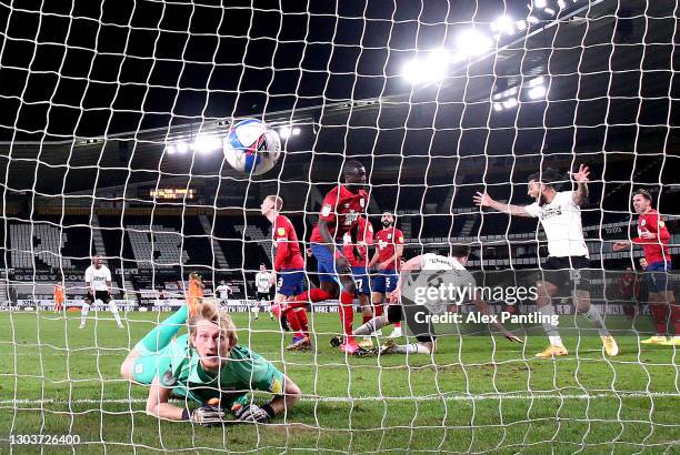 George Edmundson of Derby County scores their sides first goal past Ryan Schofield of Huddersfield Town during the Sky Bet Championship match between...