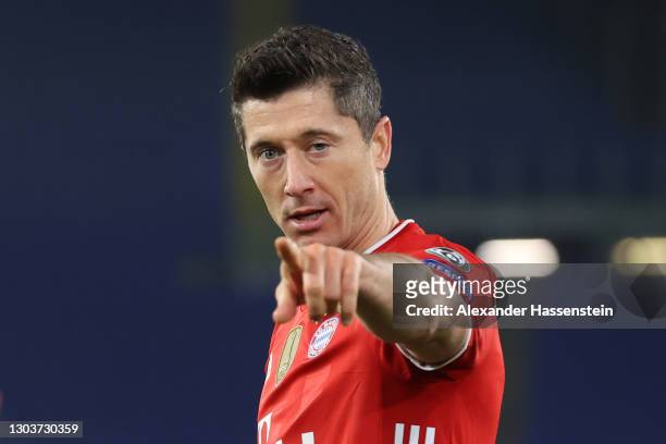 Robert Lewandowski of FC Bayern Muenchen celebrates after scoring their sides first goal during the UEFA Champions League Round of 16 match between...