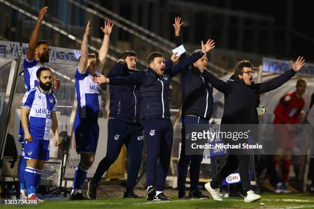 Joey Barton the manager of Bristol Rovers appeals for a penalty alongside coaching staff and substitute players during the Sky Bet League One match...