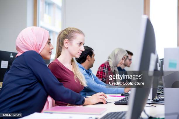 multiethnic group of students in a lecture hall. - learn arabic stock pictures, royalty-free photos & images