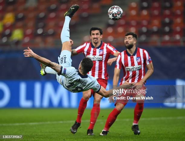 Olivier Giroud of Chelsea scores their side's first goal during the UEFA Champions League Round of 16 match between Atletico Madrid and Chelsea FC at...