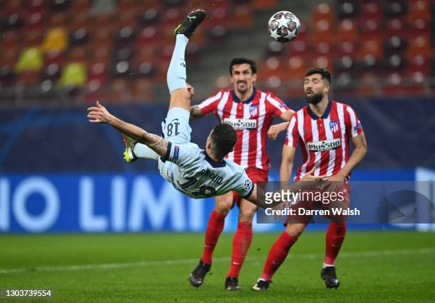 Olivier Giroud of Chelsea scores their side's first goal during the UEFA Champions League Round of 16 match between Atletico Madrid and Chelsea FC at...