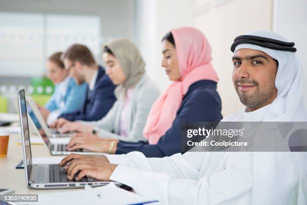 multiethnic group of businesspeople or university students - united arab emirates university stock pictures, royalty-free photos & images