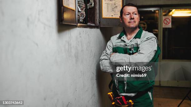 electrician at work - musical instrument repair stock pictures, royalty-free photos & images