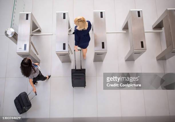 businessmen attending a conference - entering turnstile stock pictures, royalty-free photos & images